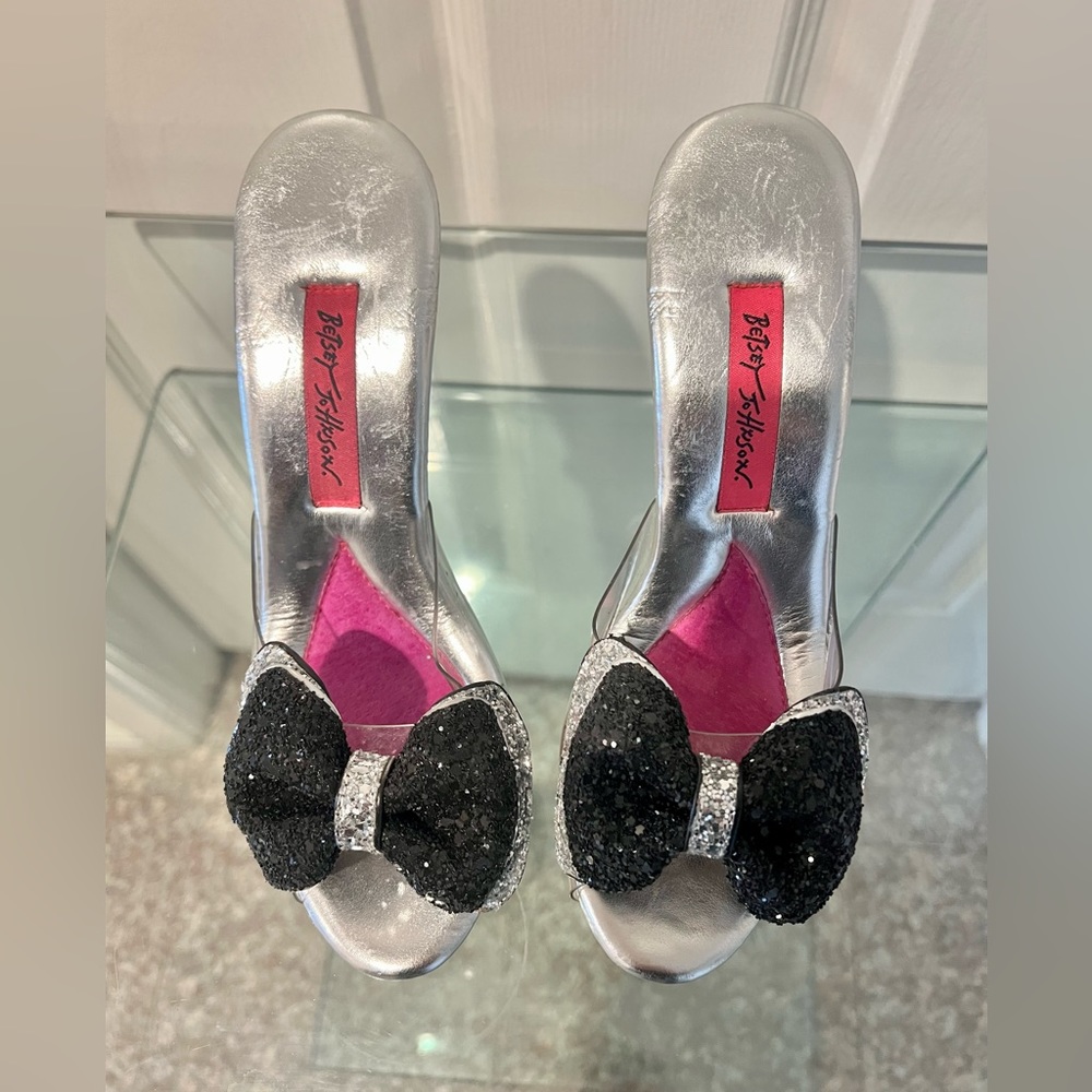 Beautiful vinyl heels with a sparkly silver and black bow. Worn only once.